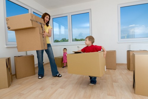 Furniture being safely moved through a narrow flat staircase